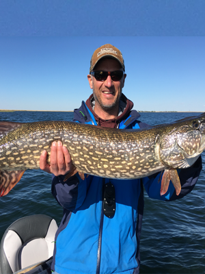 Man holding large trophy fish in his hands