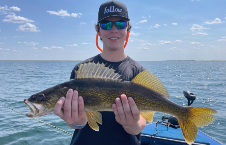 a man holding fish in his hand